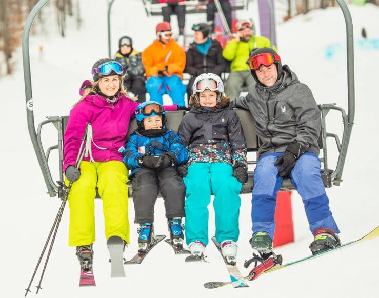 skiing family on chairlift