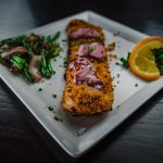 Herb Crusted Tilapia on a white square plate