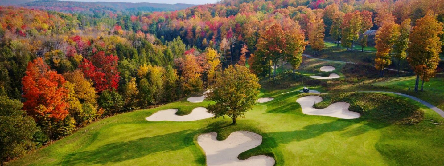 Aerial view of the green of Cedar River GC's 13th hole in the fall.