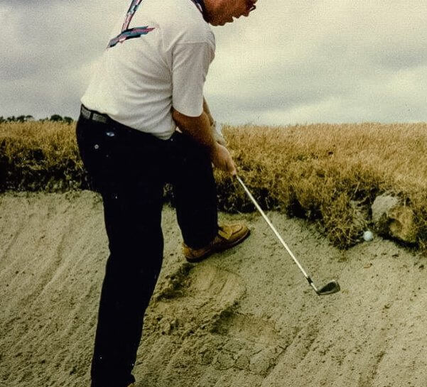 Brent Nelson Hittign a Golf Ball Out of Sand Trap