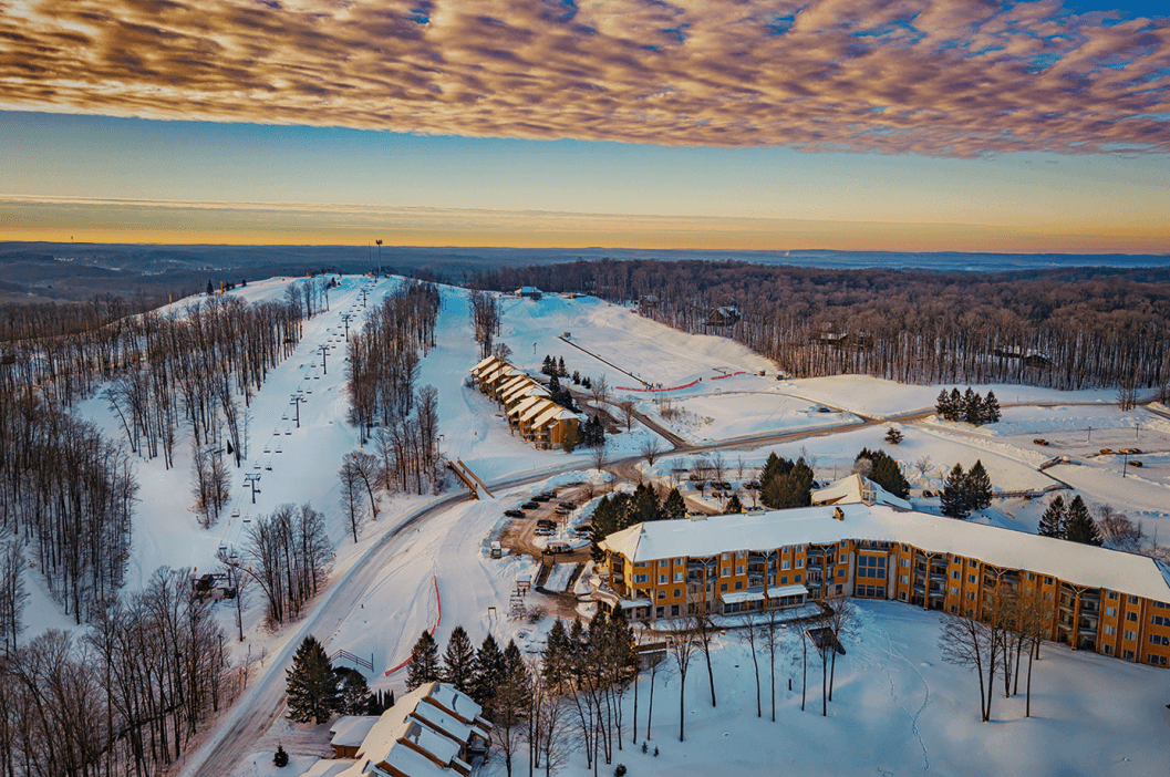 Overhead view of The Lodge at Cedar River and the slopes of Schuss Mountain next to it