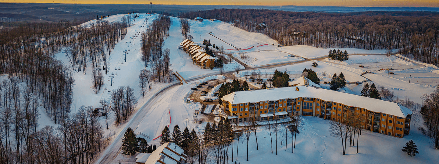 Overhead view of The Lodge at Cedar River and the slopes of Schuss Mountain next to it